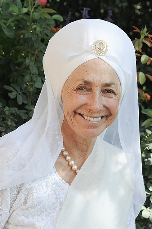 Headshot of Mukta K Khalsa in white and turban